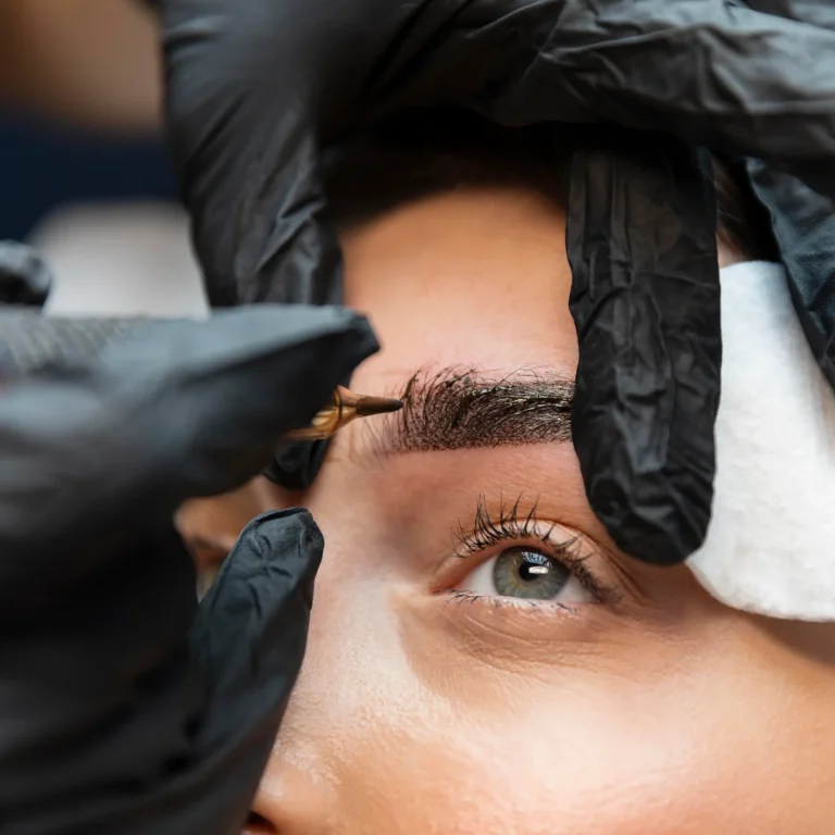 young-woman-getting-beauty-treatment-her-eyebrows-2-scaled